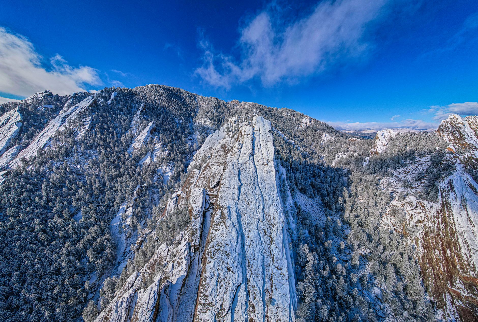 The snow-covered Flatirons above Boulder, Colorado