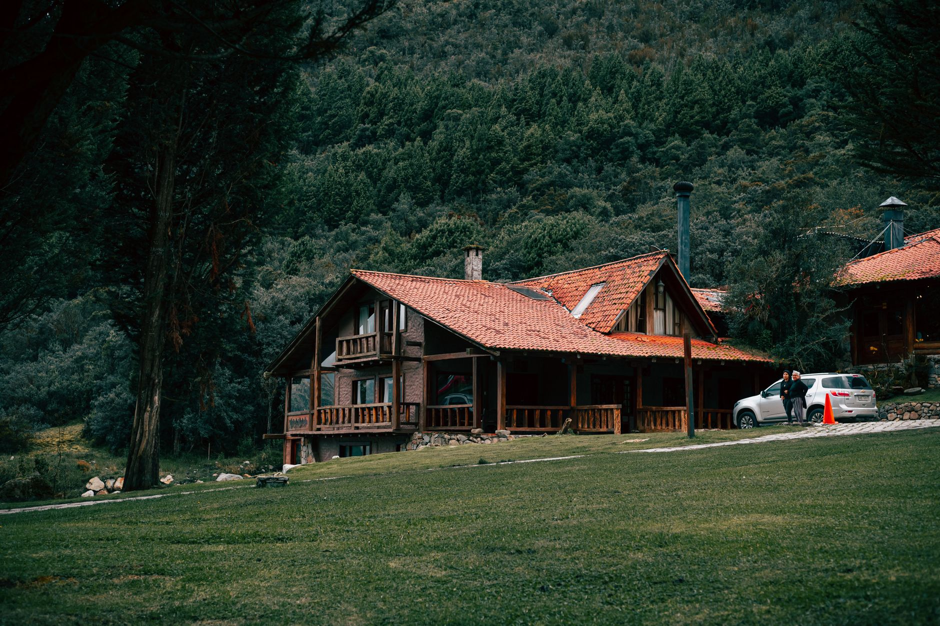 Wooden mountain lodge surrounded by forest