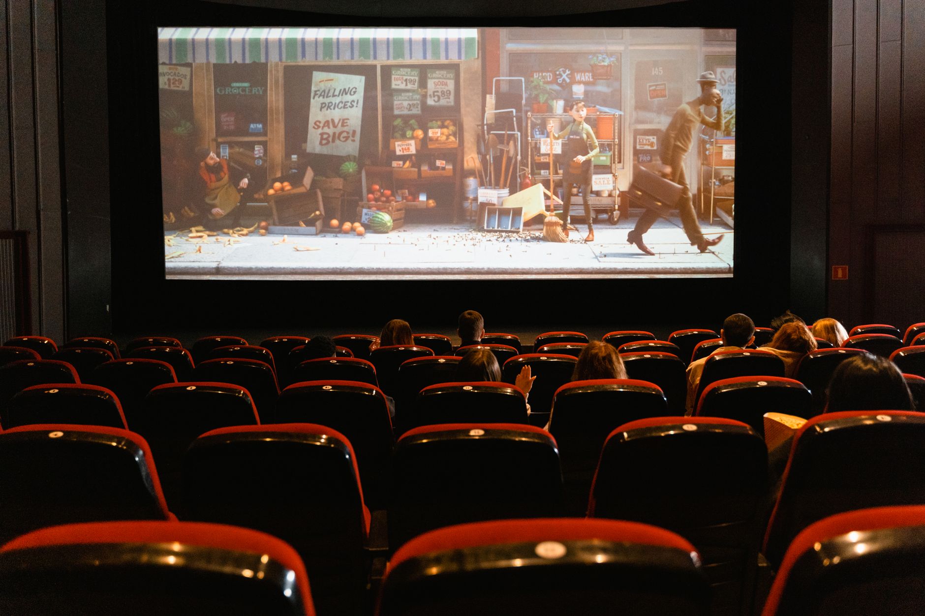 Audience watching a film in a darkened theater