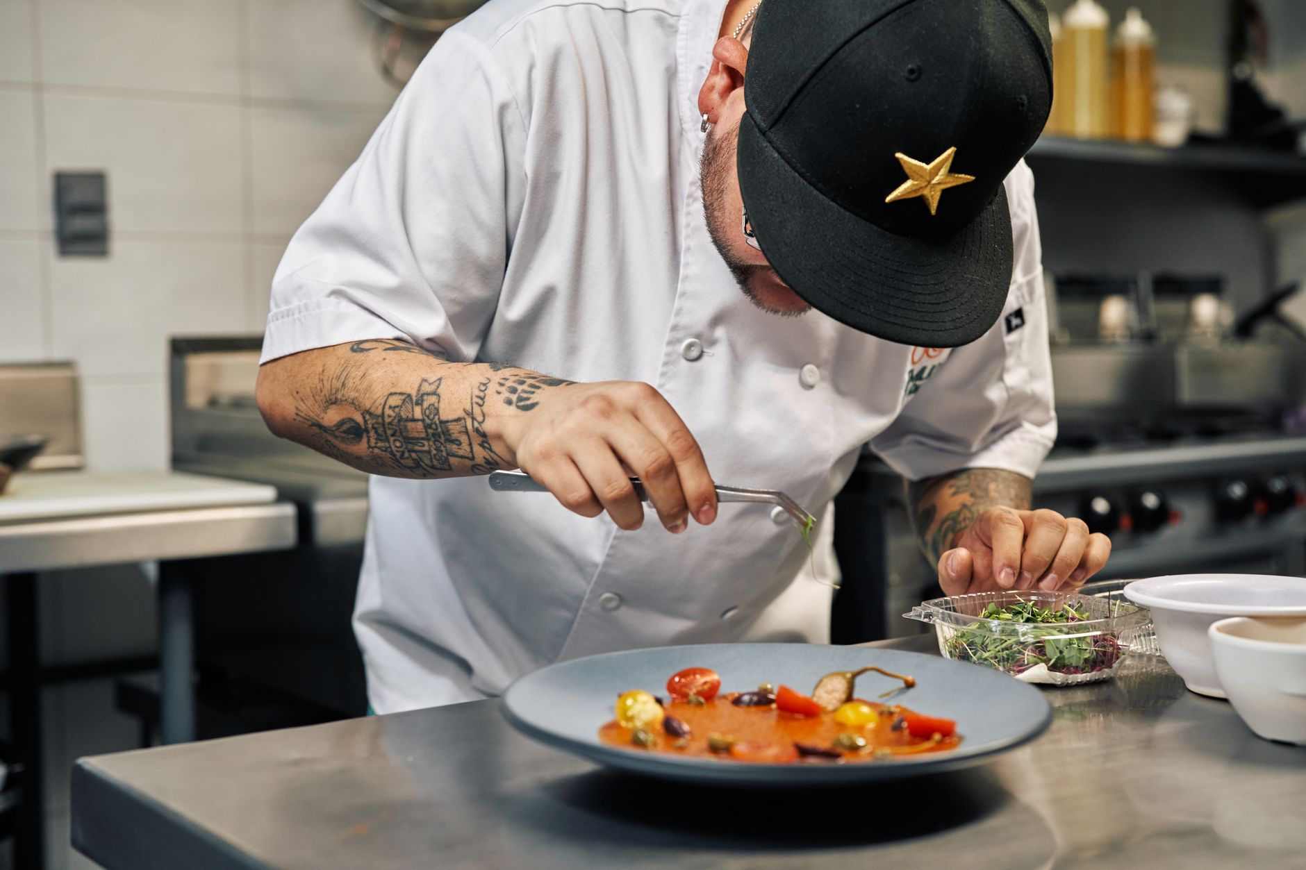 Chef plating a dish at a Boulder restaurant