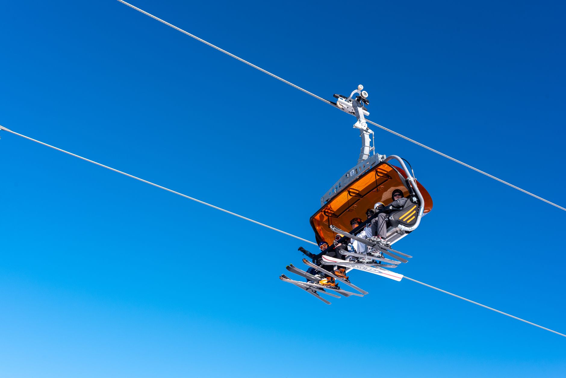Chairlift carrying skiers up a Colorado slope near Boulder