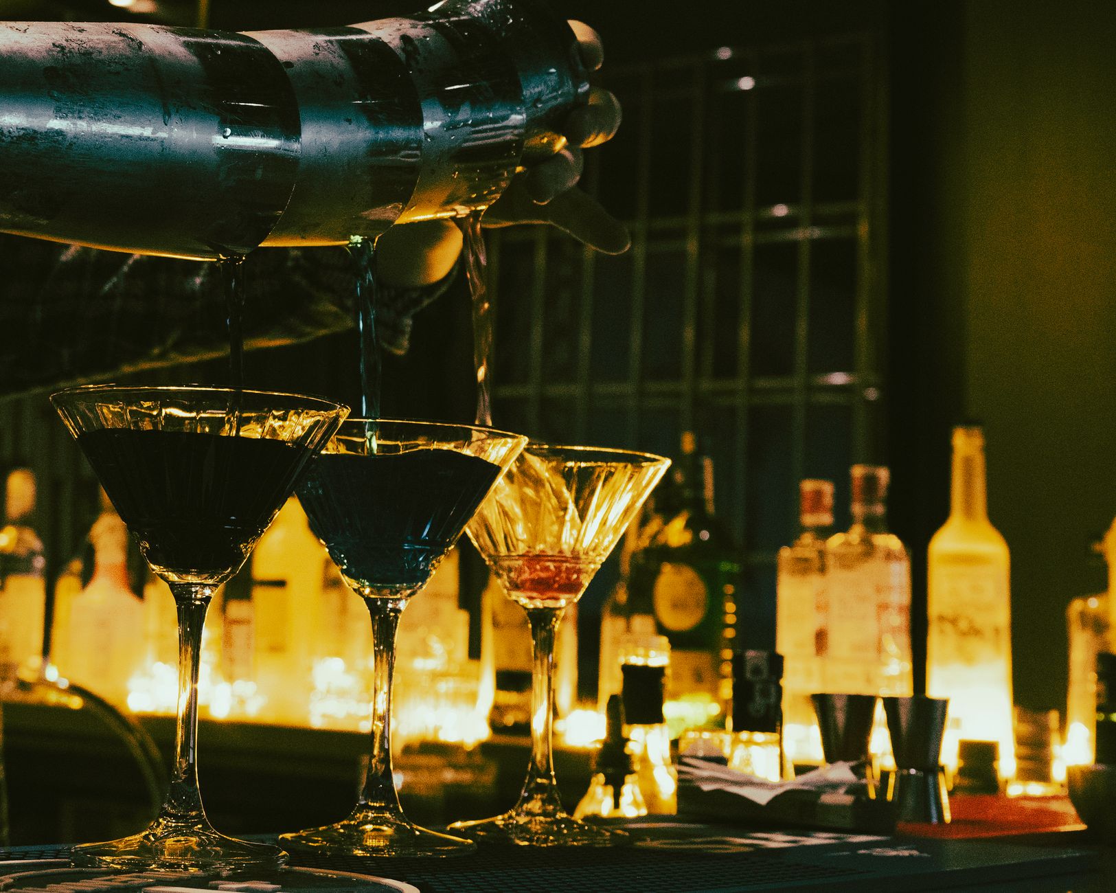 Cocktails lined up on a bar