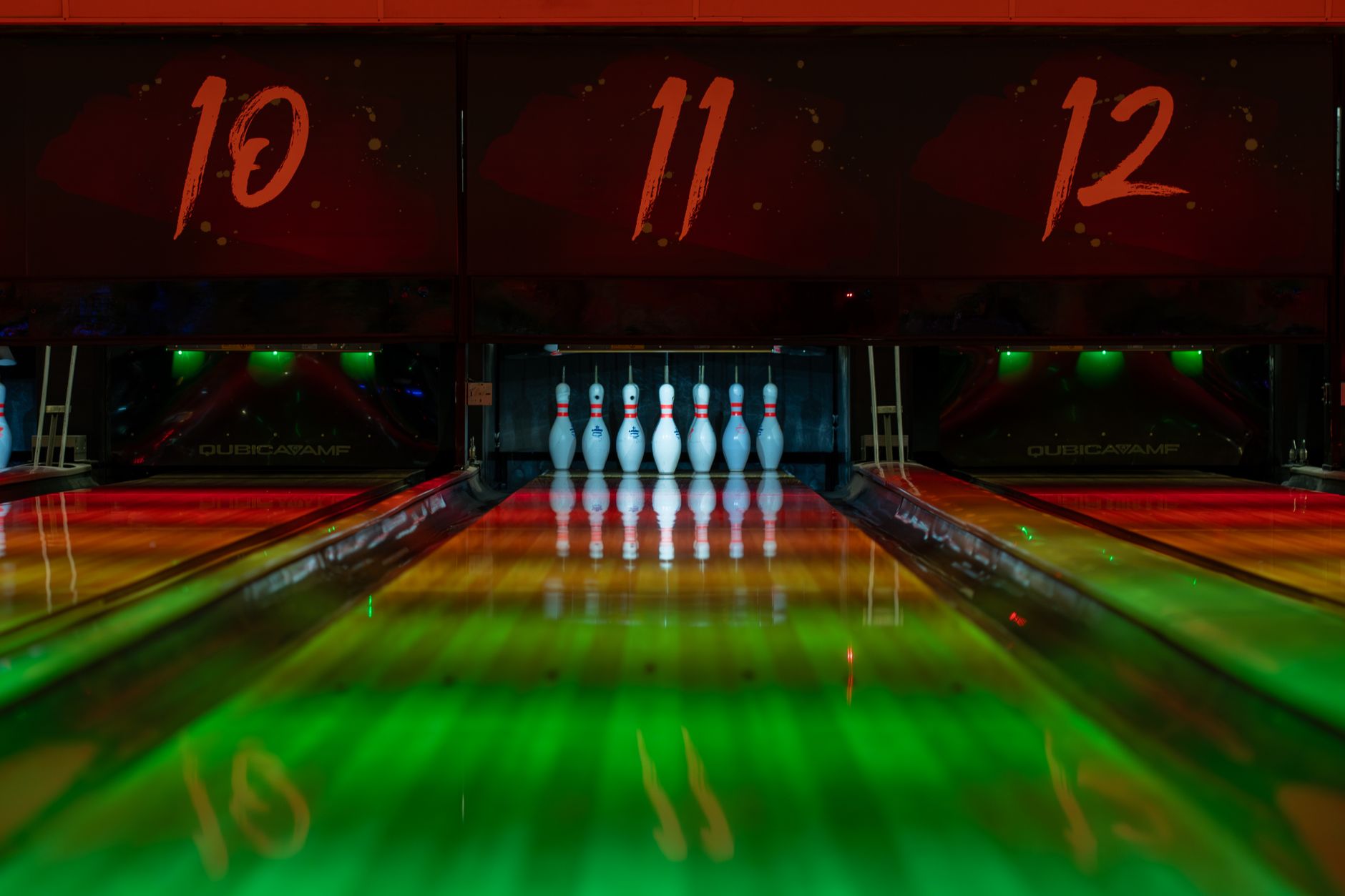 Bowling lanes lit up at night
