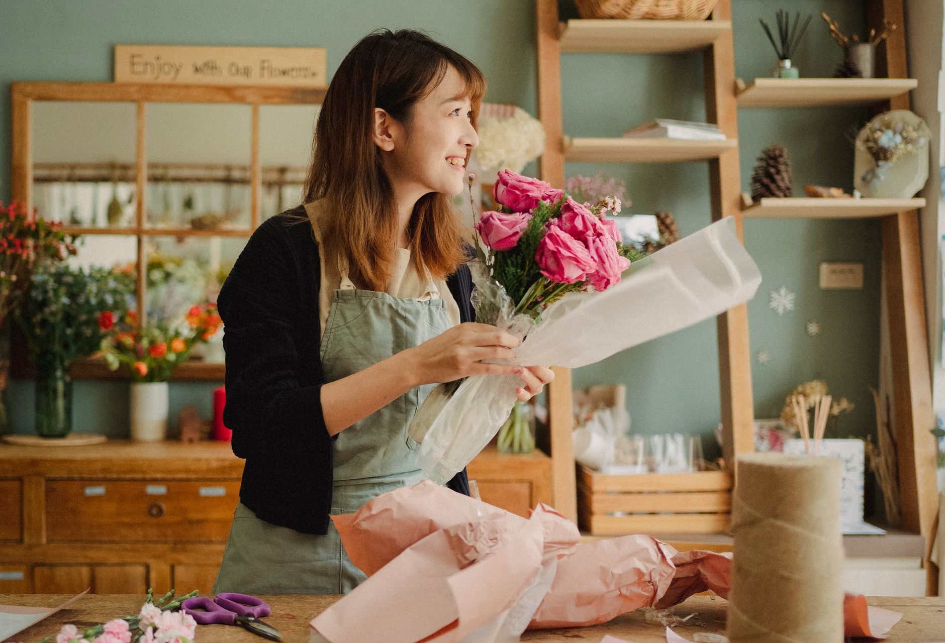 Florist arranging a bouquet in a flower shop