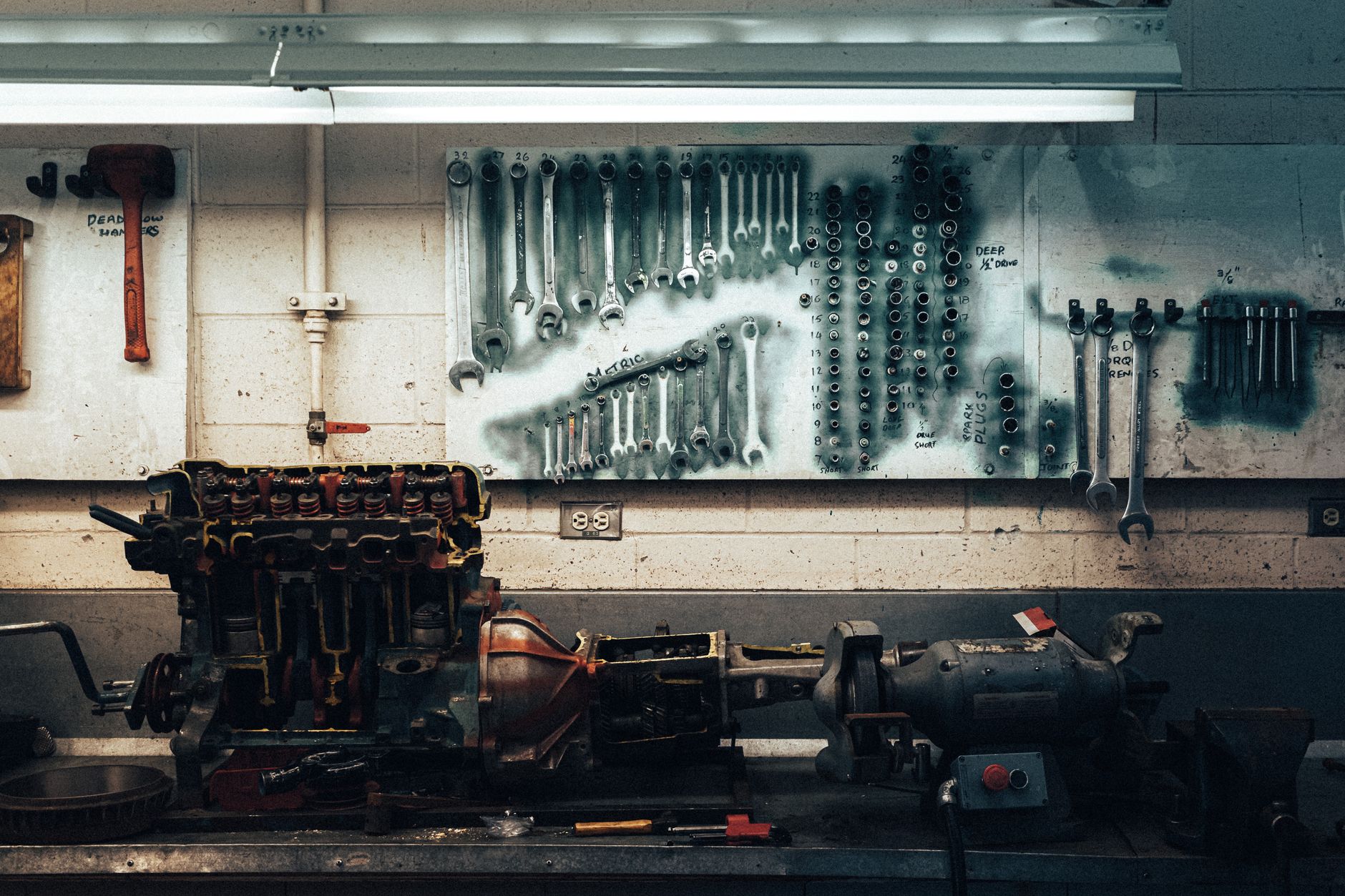 Wrenches organized on a workshop wall