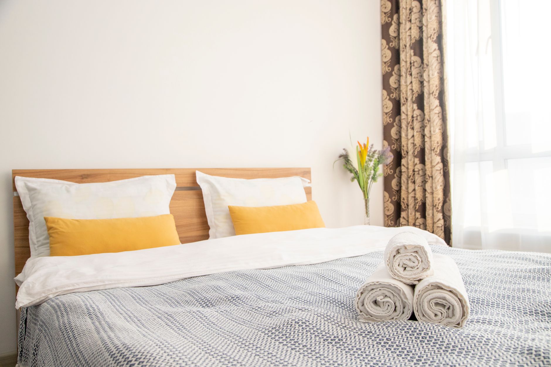 Bed in a bright modern hotel room