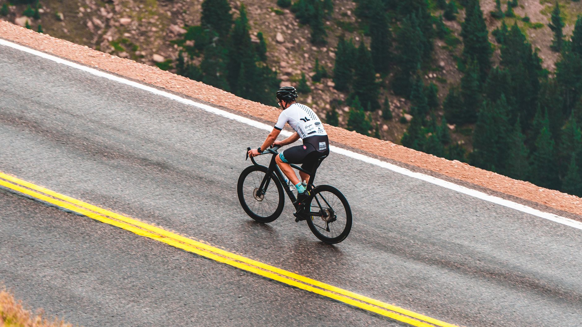 Cyclist riding a mountain road