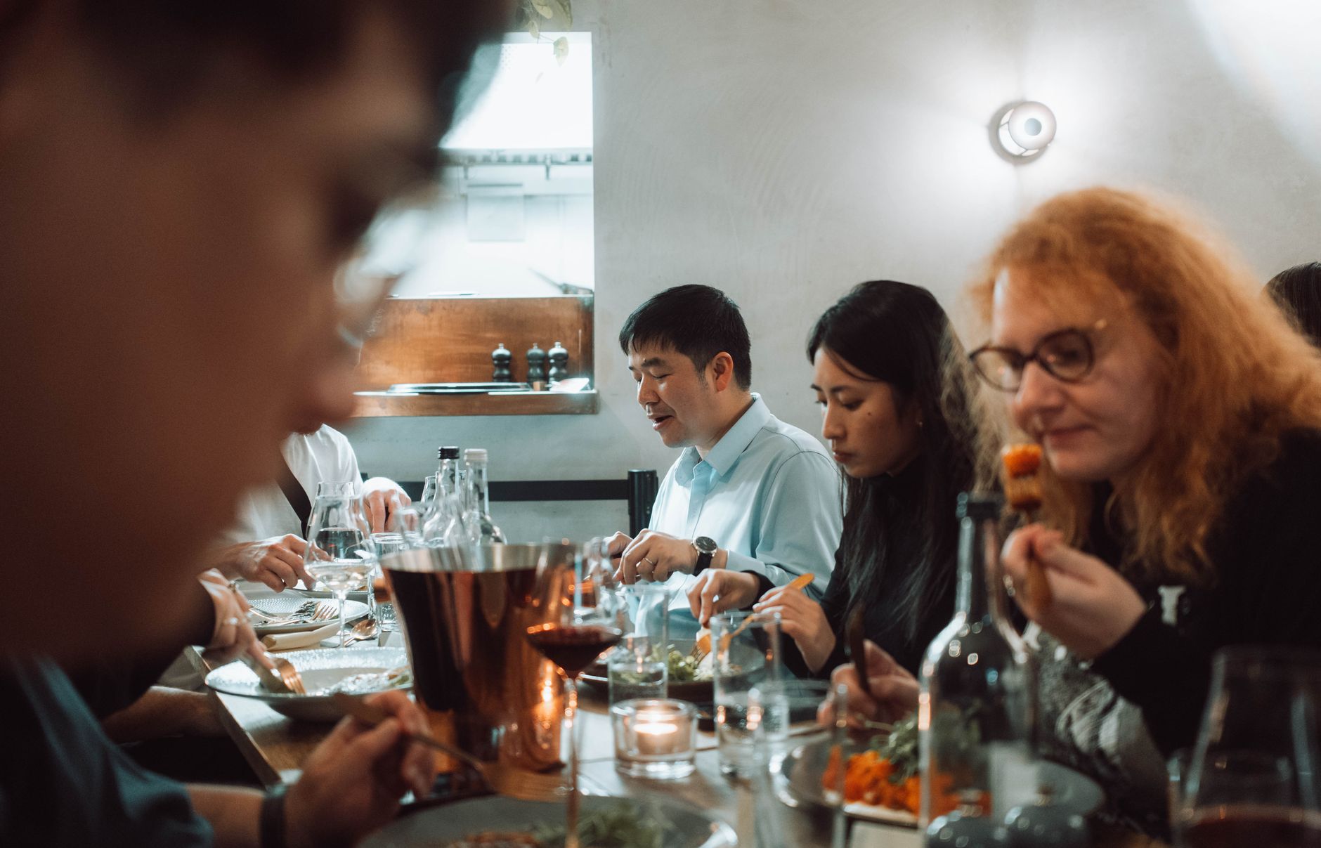 Friends sharing a meal in a cozy restaurant