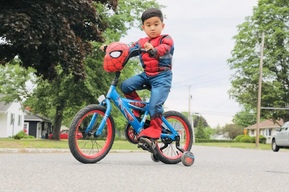 A kid rides a bike down a quiet single-family neighborhood street